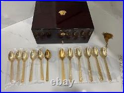 48 piece Versace Medusa Gold Gilded Flatware Set by Rosenthal in a Versace