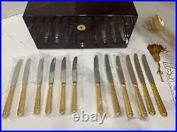 48 piece Versace Medusa Gold Gilded Flatware Set by Rosenthal in a Versace