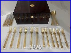 48 piece Versace Medusa Gold Gilded Flatware Set by Rosenthal in a Versace