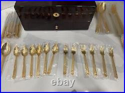 48 piece Versace Medusa Gold Gilded Flatware Set by Rosenthal in a Versace