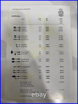 48 piece Versace Medusa Gold Gilded Flatware Set by Rosenthal in a Versace