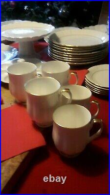 58 piece White with Gold accents Porcelain Dinner and Coffie service by Chodziez