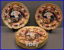 8 Antique W. T. Copeland hand painted dinner plates in a stylized Imari pattern