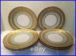 A Set of 8 Hutschenreuther Selb Bavaria Gold and Green Dinner Plates