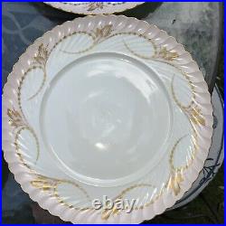 Elegance Rose set of four dinner plates by Royal Tettau. Pink with Gold trim