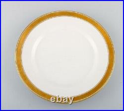 Royal Copenhagen Dagmar, White. 12 porcelain dinner plates with gold edge