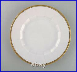 Royal Copenhagen. Six dinner plates in porcelain with gold border